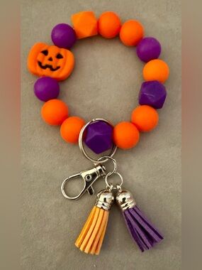 Pumpkin Beaded Wristlet Keychain - Orange & Purple tassels, silver hardware